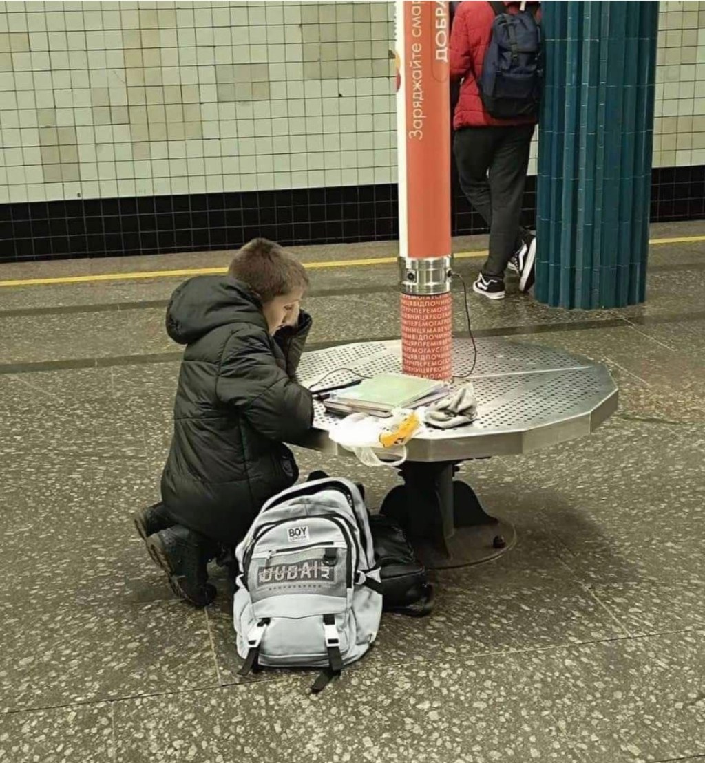11/19/2023 – A boy doing his homework at subway station in Kyiv during an air raid&nbsp;alert
